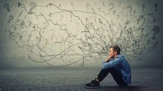 The image shows that a man experiencing the stress in his life which leads to hair-fall